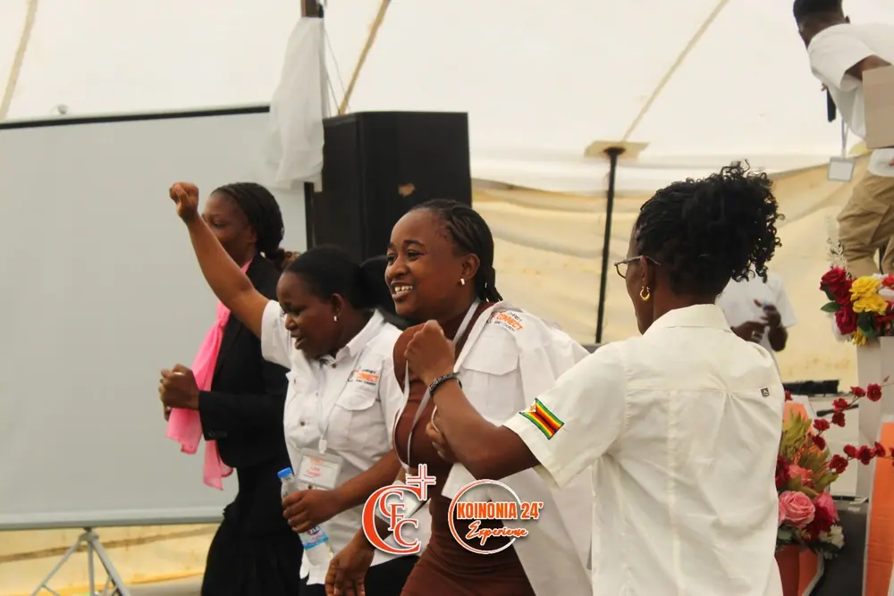 Women dancing together in praise